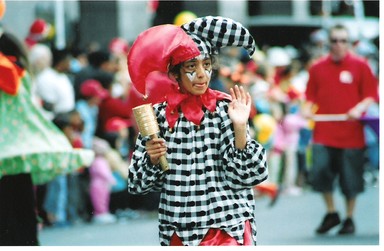 Julia Cotton; Sad ;Waving Jester boy looks forlorn at Santa Parade